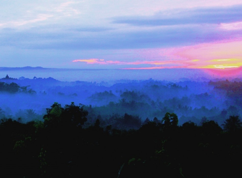 Sunrise from Punthuk Setumbu Hill overlooking Borobudur Temple and Mount Merapi