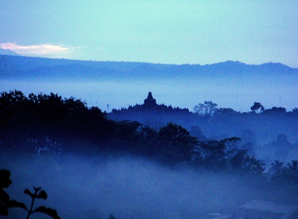 Sunrise from Punthuk Setumbu Hill overlooking Borobudur Temple and Mount Merapi